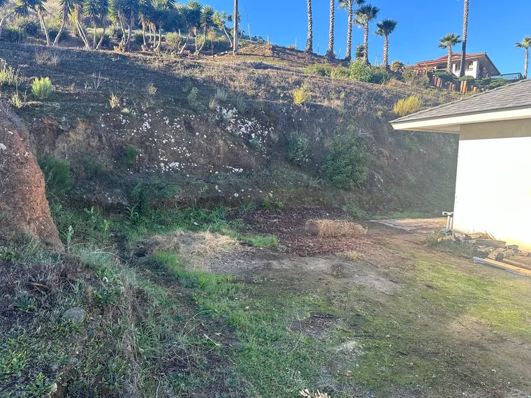 Hillside slope cleared of brush and prepared for grading
