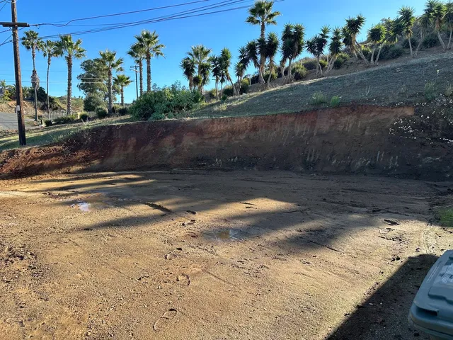 Large excavated retention basin graded and prepared for a drainage system