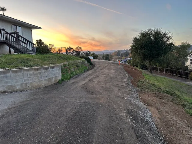 Rehabilitated roadway with fresh base and paving at sunset in Southern California